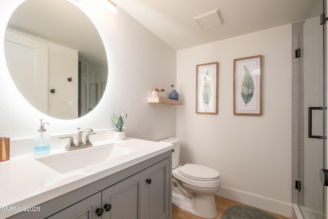 3390 Thornhill Dr, Reno, NV 89509 - bathroom featuring vanity, wood finished floors, and a shower with shower door