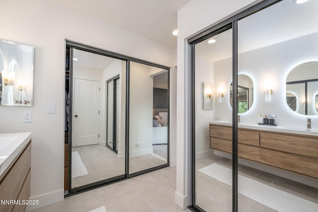 3390 Thornhill Dr, Reno, NV 89509 - full bathroom featuring double vanity, tile patterned floors, and recessed lighting