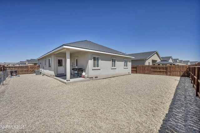 776 Great Basin Ln, Fallon, NV 89406 - back of house with stucco siding, a fenced backyard, and a patio