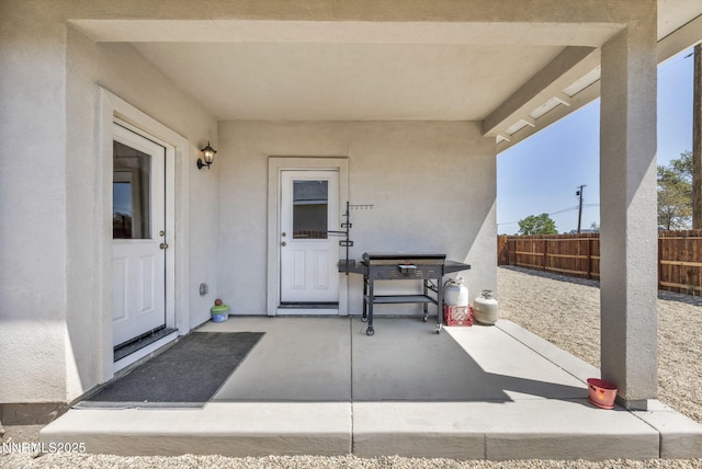 776 Great Basin Ln, Fallon, NV 89406 - view of exterior entry with stucco siding and a patio