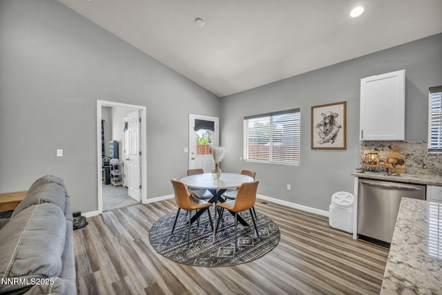 776 Great Basin Ln, Fallon, NV 89406 - dining space featuring light wood-type flooring, recessed lighting, and high vaulted ceiling