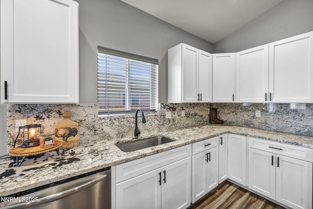 776 Great Basin Ln, Fallon, NV 89406 - kitchen featuring stainless steel dishwasher, tasteful backsplash, white cabinets, and vaulted ceiling