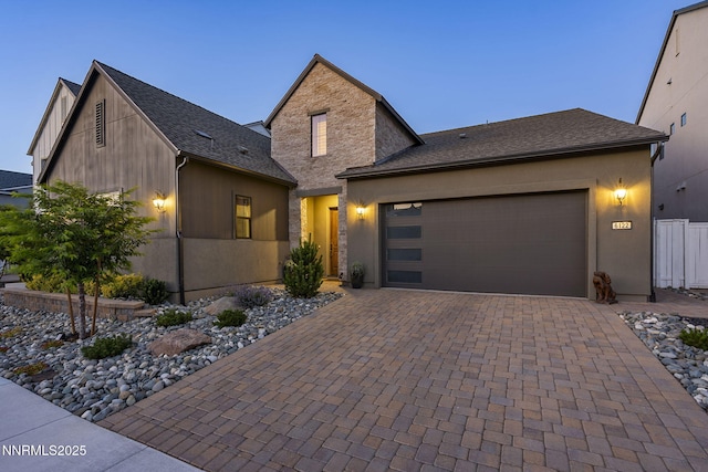6122 S Pleasant Oak Trl, Reno, NV 89511 - view of front of home featuring a garage, decorative driveway, and a shingled roof