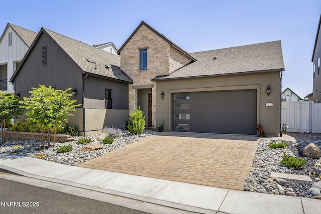 6122 S Pleasant Oak Trl, Reno, NV 89511 - view of front of property with roof with shingles, a garage, and decorative driveway