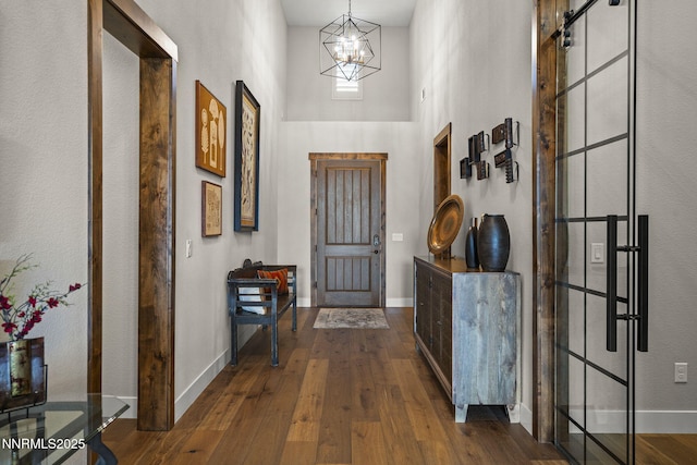 6122 S Pleasant Oak Trl, Reno, NV 89511 - foyer entrance featuring a towering ceiling, a chandelier, and wood-type flooring