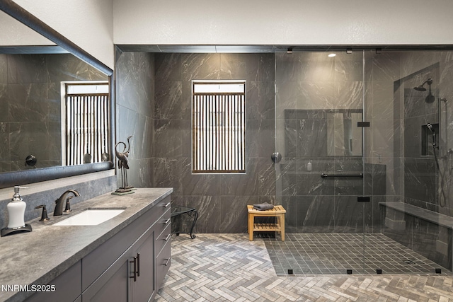 6122 S Pleasant Oak Trl, Reno, NV 89511 - full bathroom featuring vanity, a shower stall, and tile walls