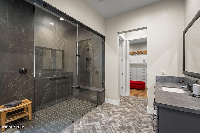 6122 S Pleasant Oak Trl, Reno, NV 89511 - bathroom with vanity, a shower stall, and brick patterned flooring