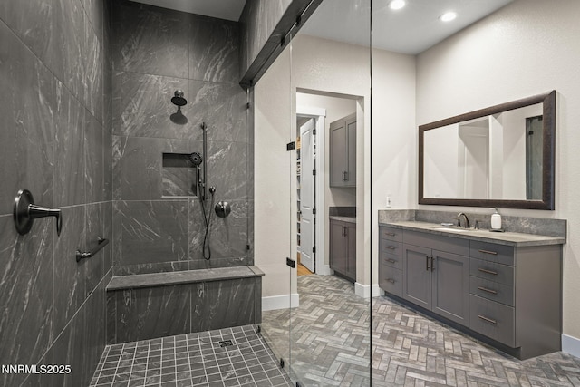 6122 S Pleasant Oak Trl, Reno, NV 89511 - full bath with a walk in shower, vanity, recessed lighting, and brick patterned floors