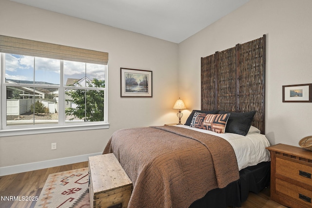 6122 S Pleasant Oak Trl, Reno, NV 89511 - bedroom featuring baseboards and wood finished floors