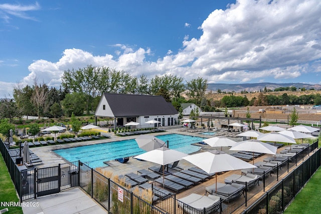6122 S Pleasant Oak Trl, Reno, NV 89511 - community pool featuring a patio area and a mountain view