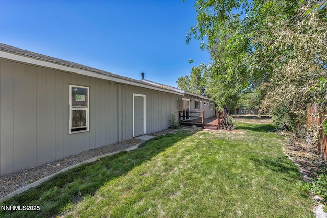 1419 Leonard Rd, Gardnerville, NV 89460 - view of green lawn featuring a wooden deck