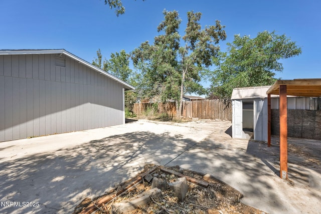 1419 Leonard Rd, Gardnerville, NV 89460 - fenced backyard with a storage shed and a patio
