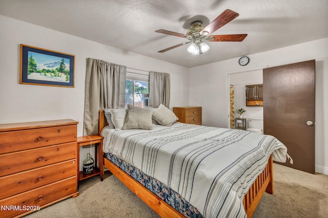 1419 Leonard Rd, Gardnerville, NV 89460 - bedroom with light colored carpet, a ceiling fan, ensuite bathroom, and a textured ceiling