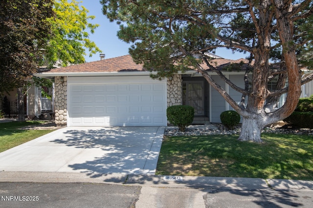 2240 Silver Ridge Dr, Reno, NV 89509 - view of property hidden behind natural elements featuring stone siding, concrete driveway, a garage, a front lawn, and a shingled roof