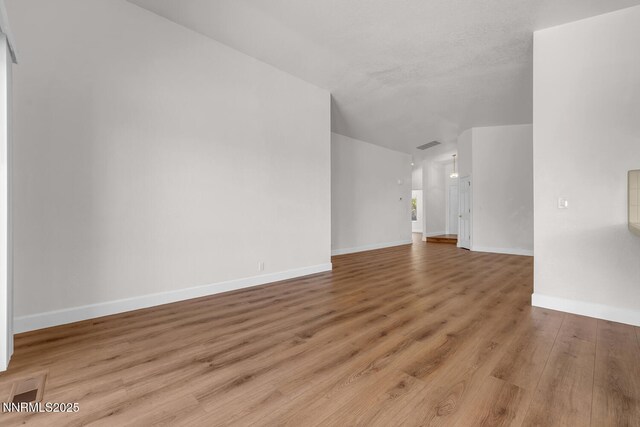 2240 Silver Ridge Dr, Reno, NV 89509 - unfurnished living room featuring wood finished floors and baseboards