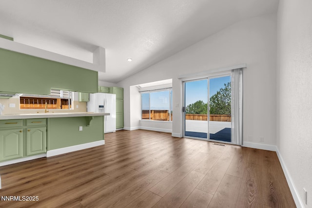 2240 Silver Ridge Dr, Reno, NV 89509 - unfurnished living room with vaulted ceiling and dark wood-style floors