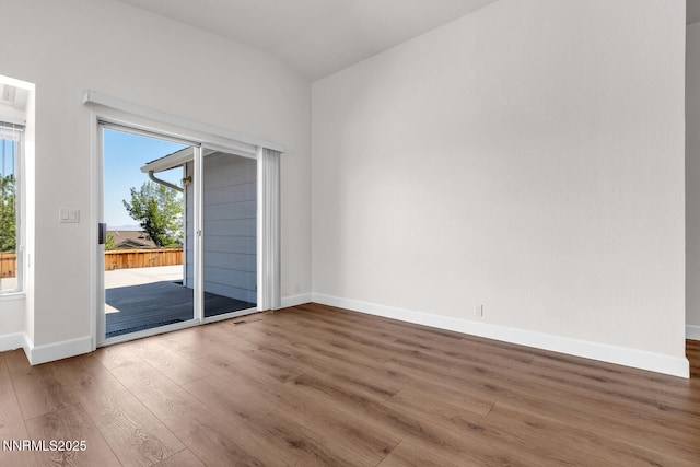 2240 Silver Ridge Dr, Reno, NV 89509 - empty room with wood finished floors and vaulted ceiling