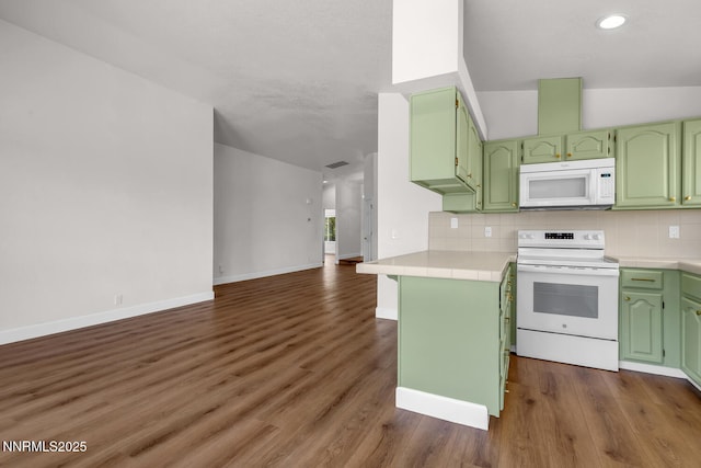 2240 Silver Ridge Dr, Reno, NV 89509 - kitchen with white appliances, tile counters, green cabinetry, decorative backsplash, and open floor plan