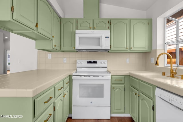 2240 Silver Ridge Dr, Reno, NV 89509 - kitchen with white appliances, tasteful backsplash, and a peninsula