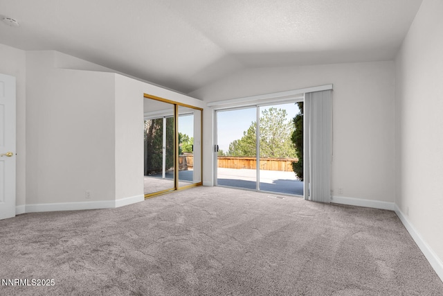 2240 Silver Ridge Dr, Reno, NV 89509 - carpeted empty room with vaulted ceiling and a smoke detector