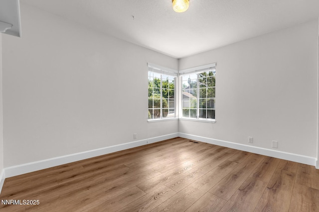 2240 Silver Ridge Dr, Reno, NV 89509 - unfurnished room featuring baseboards and hardwood / wood-style flooring