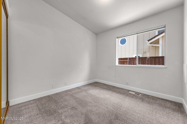 2240 Silver Ridge Dr, Reno, NV 89509 - unfurnished room featuring carpet flooring and lofted ceiling