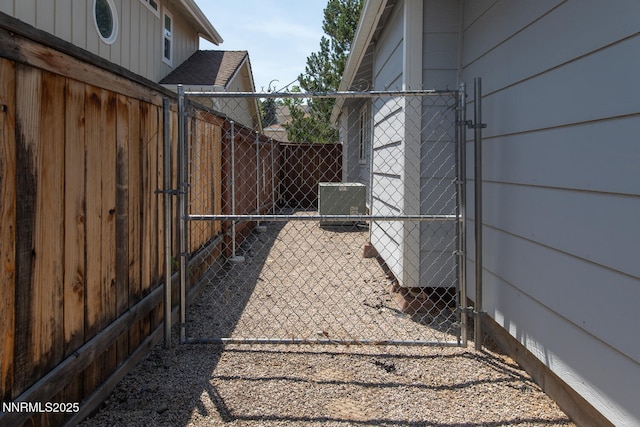 2240 Silver Ridge Dr, Reno, NV 89509 - view of side of home with a gate and a central air condition unit