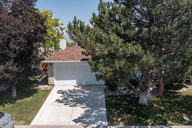 2240 Silver Ridge Dr, Reno, NV 89509 - view of property hidden behind natural elements with concrete driveway, a front yard, roof with shingles, an attached garage, and a chimney