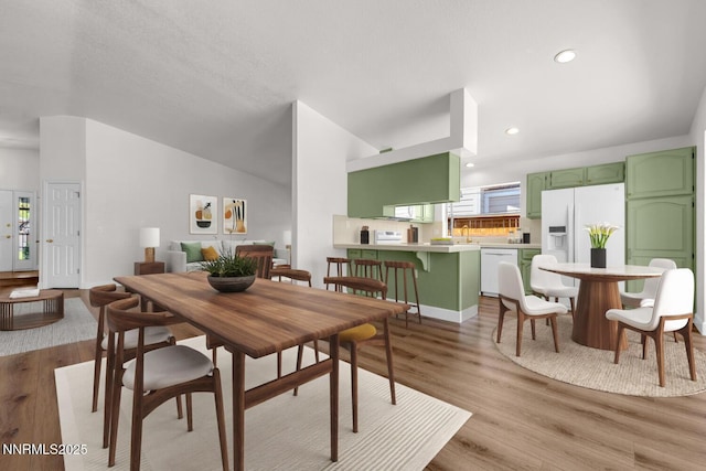 2240 Silver Ridge Dr, Reno, NV 89509 - dining space with light wood-type flooring and recessed lighting