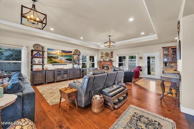 1962 Comstock Dr, Gardnerville, NV 89410 - living area with a chandelier, a tray ceiling, recessed lighting, wood finished floors, and crown molding