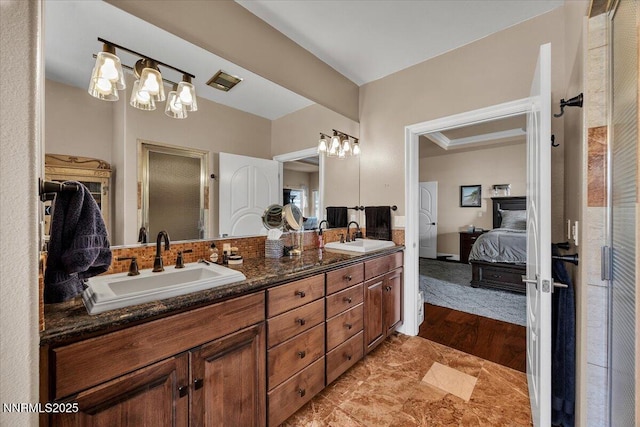 1962 Comstock Dr, Gardnerville, NV 89410 - ensuite bathroom featuring double vanity and wood finished floors