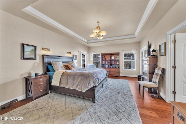 1962 Comstock Dr, Gardnerville, NV 89410 - bedroom with a tray ceiling, crown molding, a chandelier, and wood finished floors
