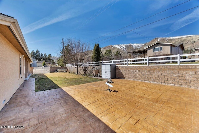 1962 Comstock Dr, Gardnerville, NV 89410 - fenced backyard with a mountain view and a patio