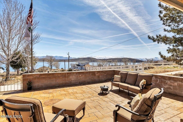 1962 Comstock Dr, Gardnerville, NV 89410 - fenced backyard featuring an outdoor hangout area, a mountain view, and a patio area