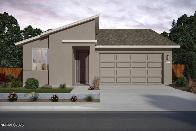 680 E Patrician Dr Lot 11, Reno, NV 89506 - view of front of house featuring stucco siding, concrete driveway, a garage, and roof with shingles