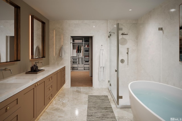 323 Tramway Dr # 301, Stateline, NV 89449 - bathroom featuring a shower stall, a soaking tub, a walk in closet, and marble tiled floors