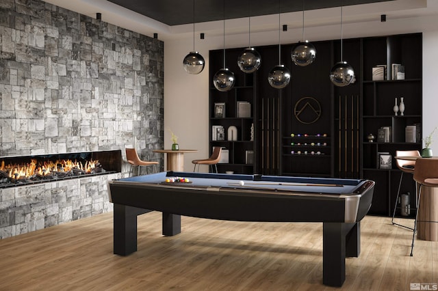 323 Tramway Dr # 301, Stateline, NV 89449 - recreation room featuring wood finished floors, a tray ceiling, billiards, and a fireplace