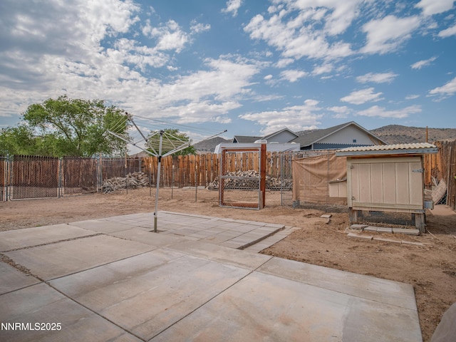 2843 Wade St, Minden, NV 89423 - fenced backyard with a patio area and exterior structure