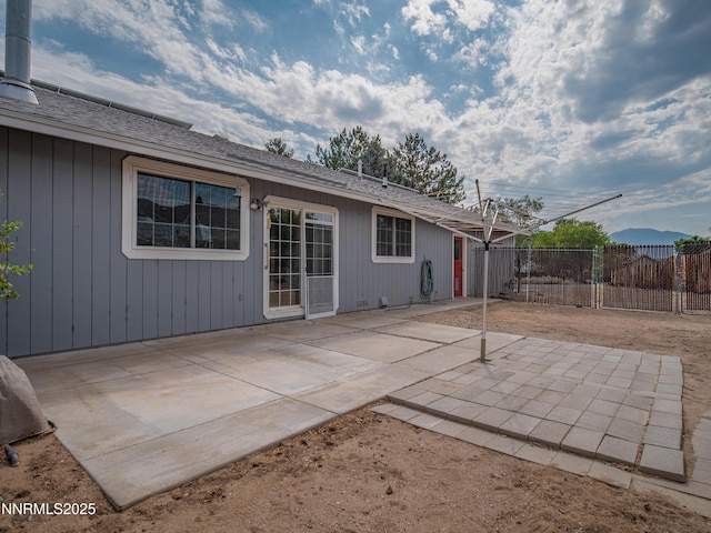 2843 Wade St, Minden, NV 89423 - rear view of property featuring a patio and roof with shingles