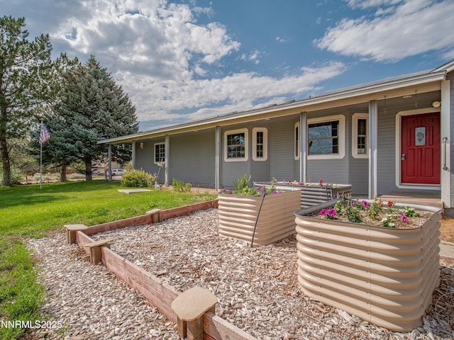 2843 Wade St, Minden, NV 89423 - view of front of home featuring a front lawn and a garden