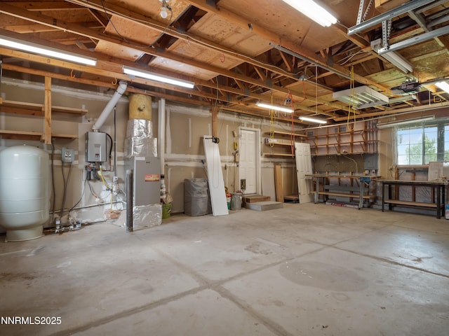 2843 Wade St, Minden, NV 89423 - below grade area with a water pressure tank, a garage, heating unit, and water heater