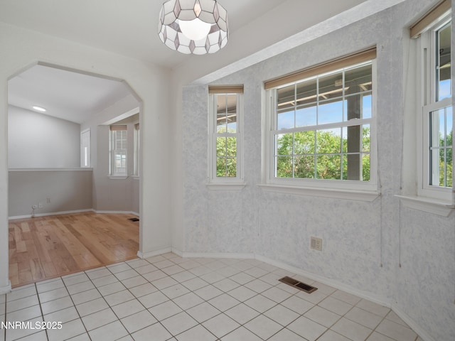 2843 Wade St, Minden, NV 89423 - unfurnished room with arched walkways and light tile patterned floors