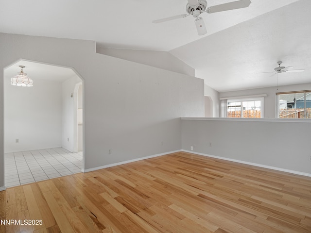 2843 Wade St, Minden, NV 89423 - spare room with a ceiling fan, wood finished floors, lofted ceiling, and arched walkways