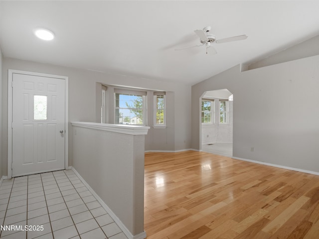 2843 Wade St, Minden, NV 89423 - entrance foyer featuring light wood-style floors, ceiling fan, vaulted ceiling, and arched walkways