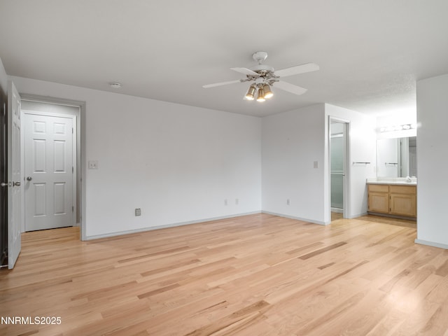 2843 Wade St, Minden, NV 89423 - unfurnished bedroom featuring light wood finished floors, ensuite bath, and ceiling fan