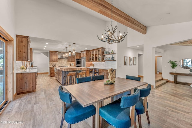 116 Cypress Way, Stateline, NV 89449 - dining room featuring a chandelier, wine cooler, light wood-style flooring, recessed lighting, and beam ceiling