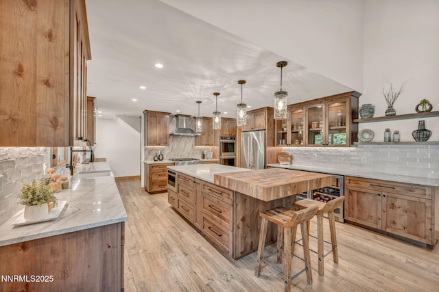 116 Cypress Way, Stateline, NV 89449 - kitchen with stainless steel appliances, tasteful backsplash, beverage cooler, wall chimney exhaust hood, and a large island