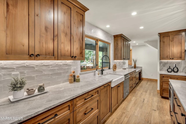 116 Cypress Way, Stateline, NV 89449 - kitchen featuring brown cabinets, light wood-style floors, tasteful backsplash, and recessed lighting