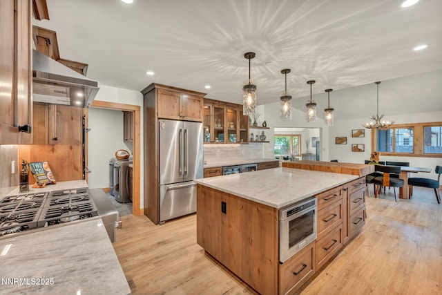 116 Cypress Way, Stateline, NV 89449 - kitchen with freestanding refrigerator, wall chimney range hood, backsplash, recessed lighting, and range