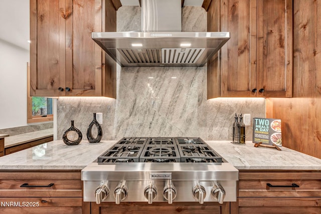116 Cypress Way, Stateline, NV 89449 - kitchen with wall chimney exhaust hood, brown cabinetry, stainless steel gas stovetop, and tasteful backsplash